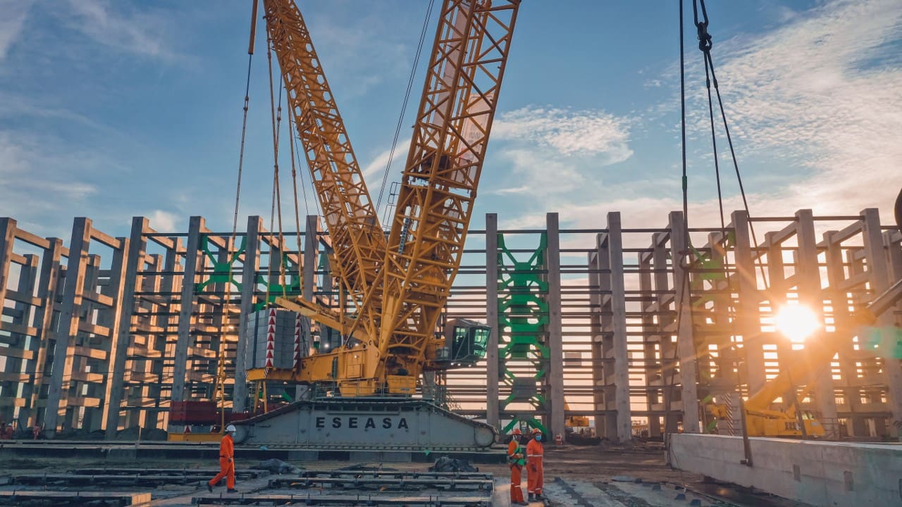 A large crane is in the middle of construction.